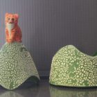 Ceramic trinket holder with a cat on top.