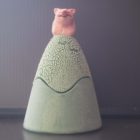 Ceramic trinket holder with a pig on top.