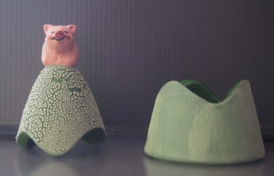 Ceramic trinket holder with a pig on top.