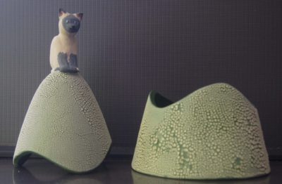 Ceramic trinket holder with a cat on top.