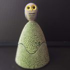 Ceramic trinket holder with an owl on top.