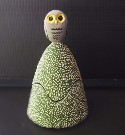 Ceramic trinket holder with an owl on top.