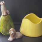 Ceramic trinket holder with a lioness on top.