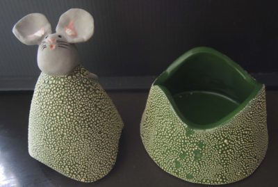 Ceramic trinket holder with a mouse on top.