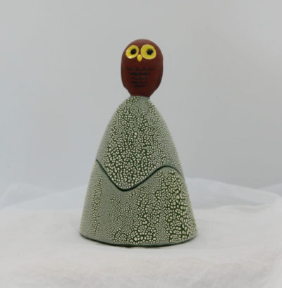 Ceramic trinket holder with a grey owl on top.