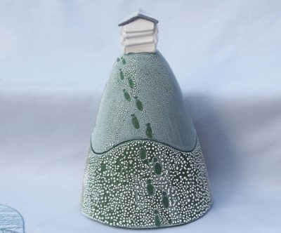 Ceramic trinket holder with a beehive on top.