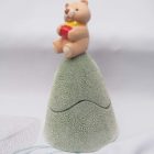 Ceramic trinket holder with a teddy bear on top.