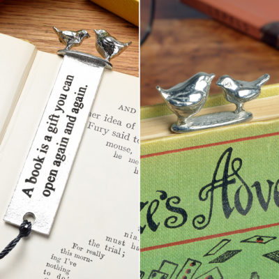 Pewter bookmark with a 2 bird sculpture on the top. The quotation 'A book is a gift you can open again and again' is written down its length.