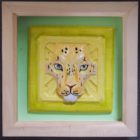 Ceramic tile of a leopard face