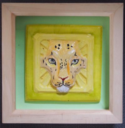 Ceramic tile of a leopard face