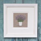 Hand embroidered white Lavender pot on beige linen background and framed is a white mount and frame