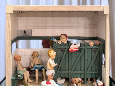 Ceramic Figures trapped in wooden stalls convey inner turmoil