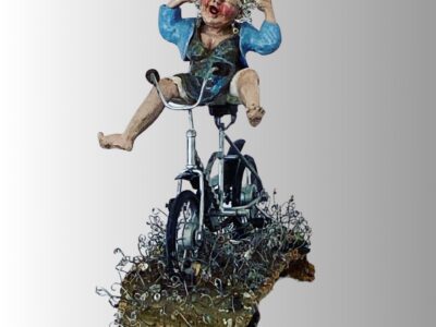 Ceramic sculpture of a joyful woman riding a whimsical metal bicycle.